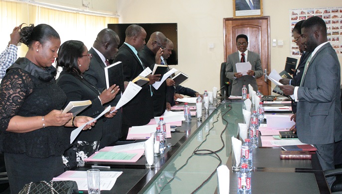 Prof. Kwesi Yankah (middle), The Minister pf State in charge of Tertiary Education, swearing in the Council of the Chartered Institute of Taxation